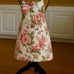 Floral apron on mannequin in kitchen