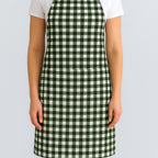 Green gingham cotton apron on model