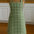 Gingham apron on mannequin in kitchen