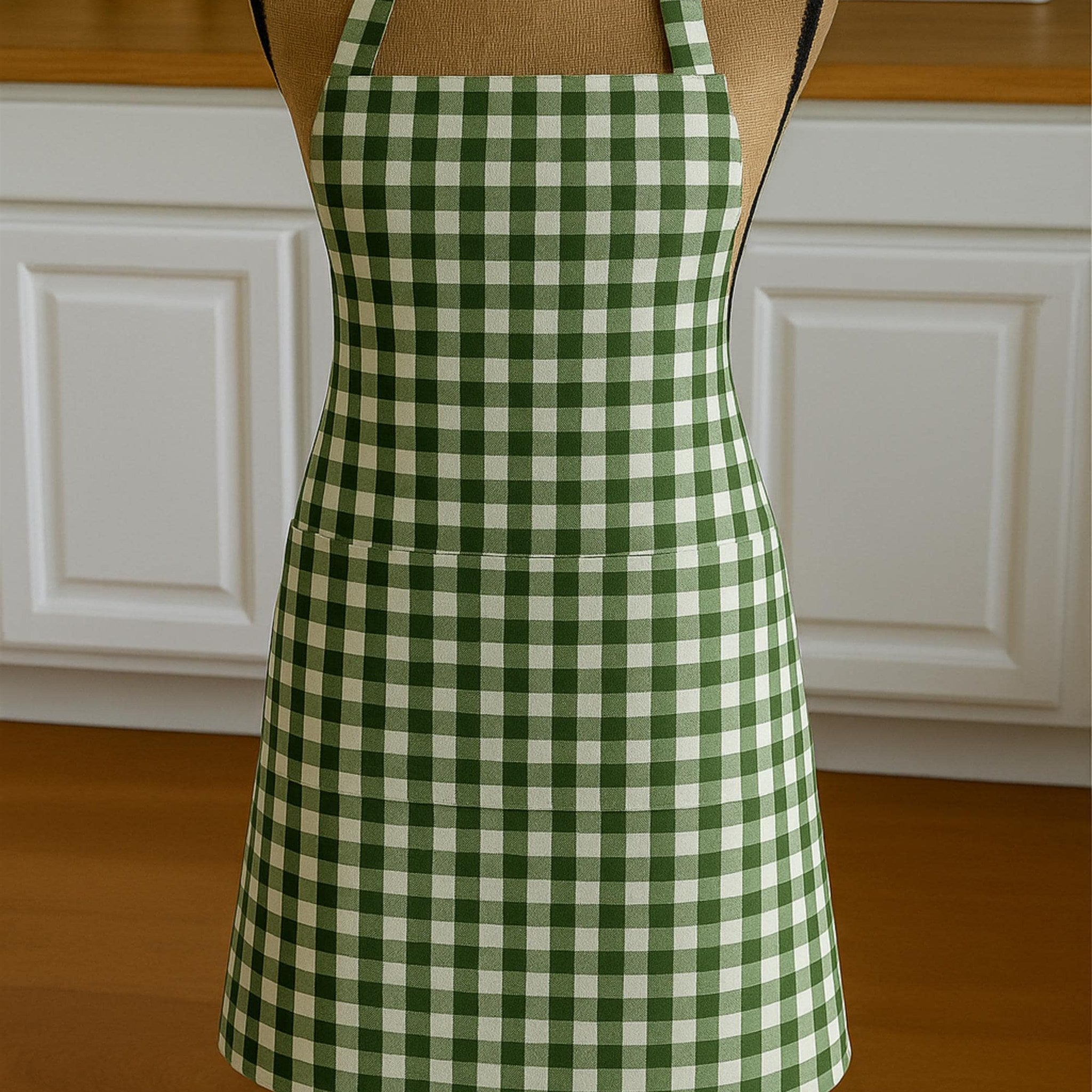 Gingham apron on mannequin in kitchen