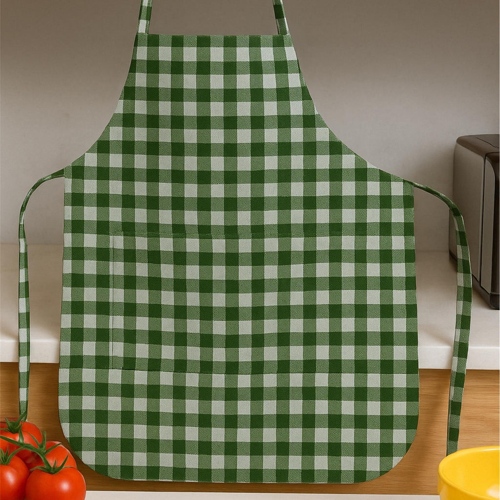 Gingham apron hanging in kitchen with cooking scene