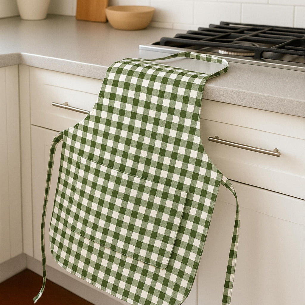 Gingham apron draped on kitchen counter