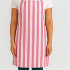 Pink striped cotton apron on model