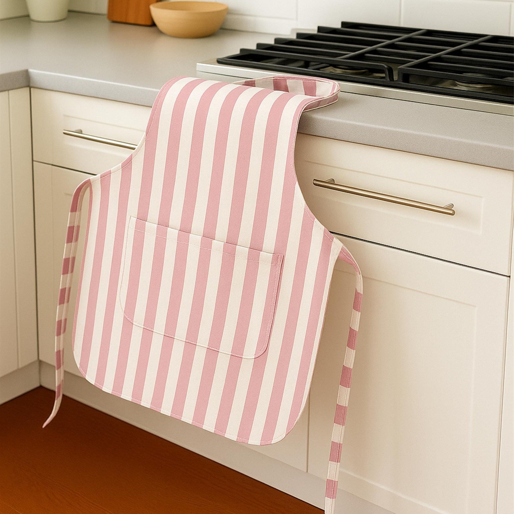 Pink striped apron draped on counter