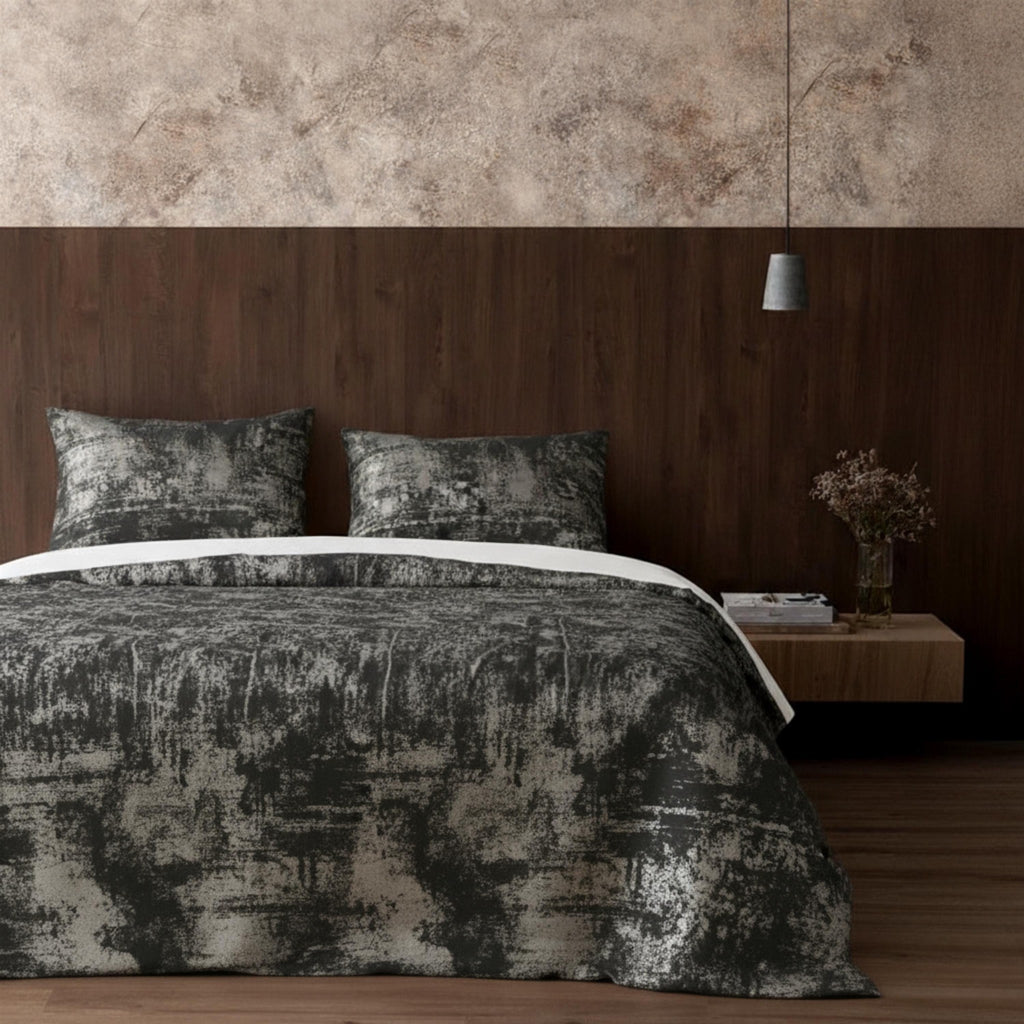 Gray velvet bedspread in dark bedroom