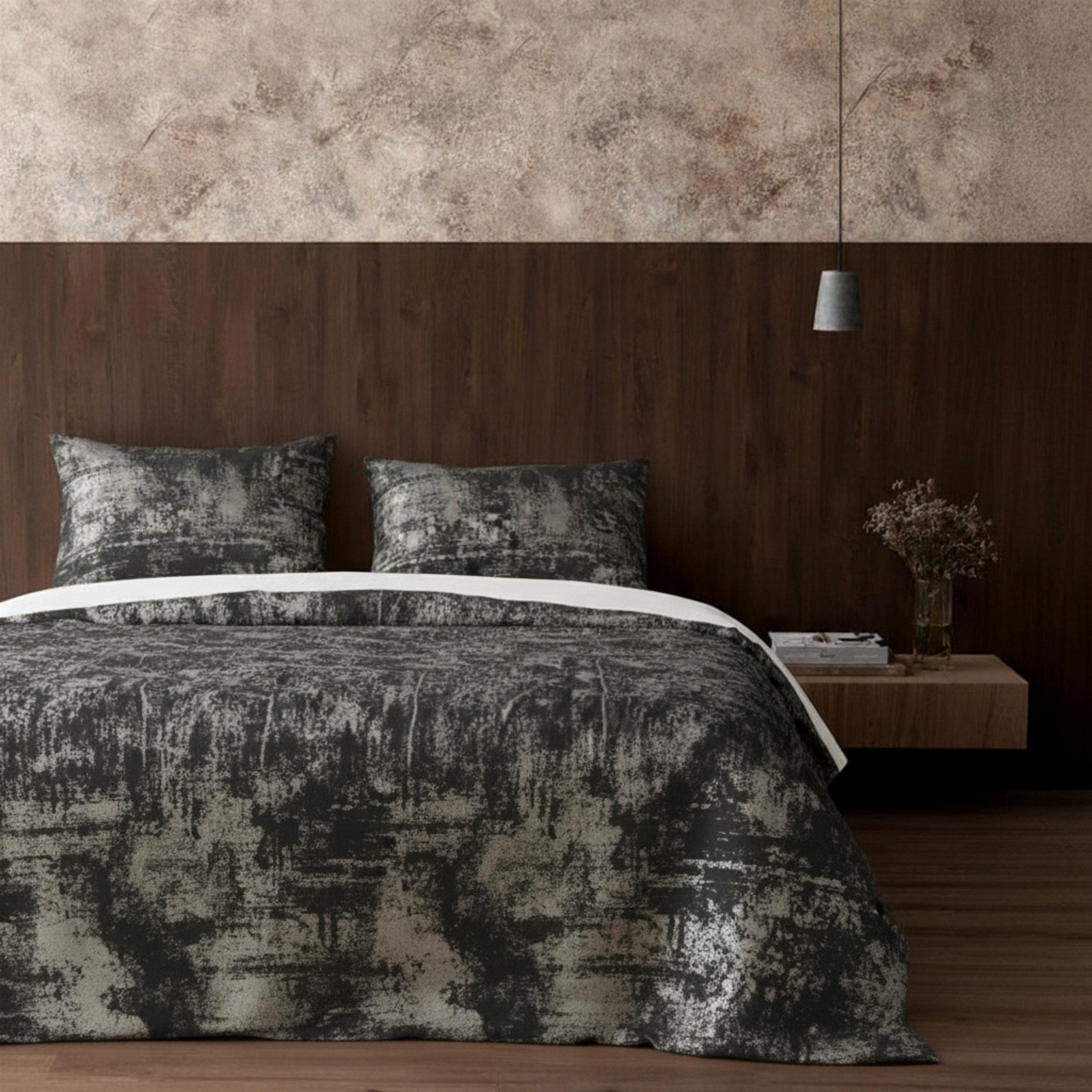 Gray velvet bedspread in dark bedroom