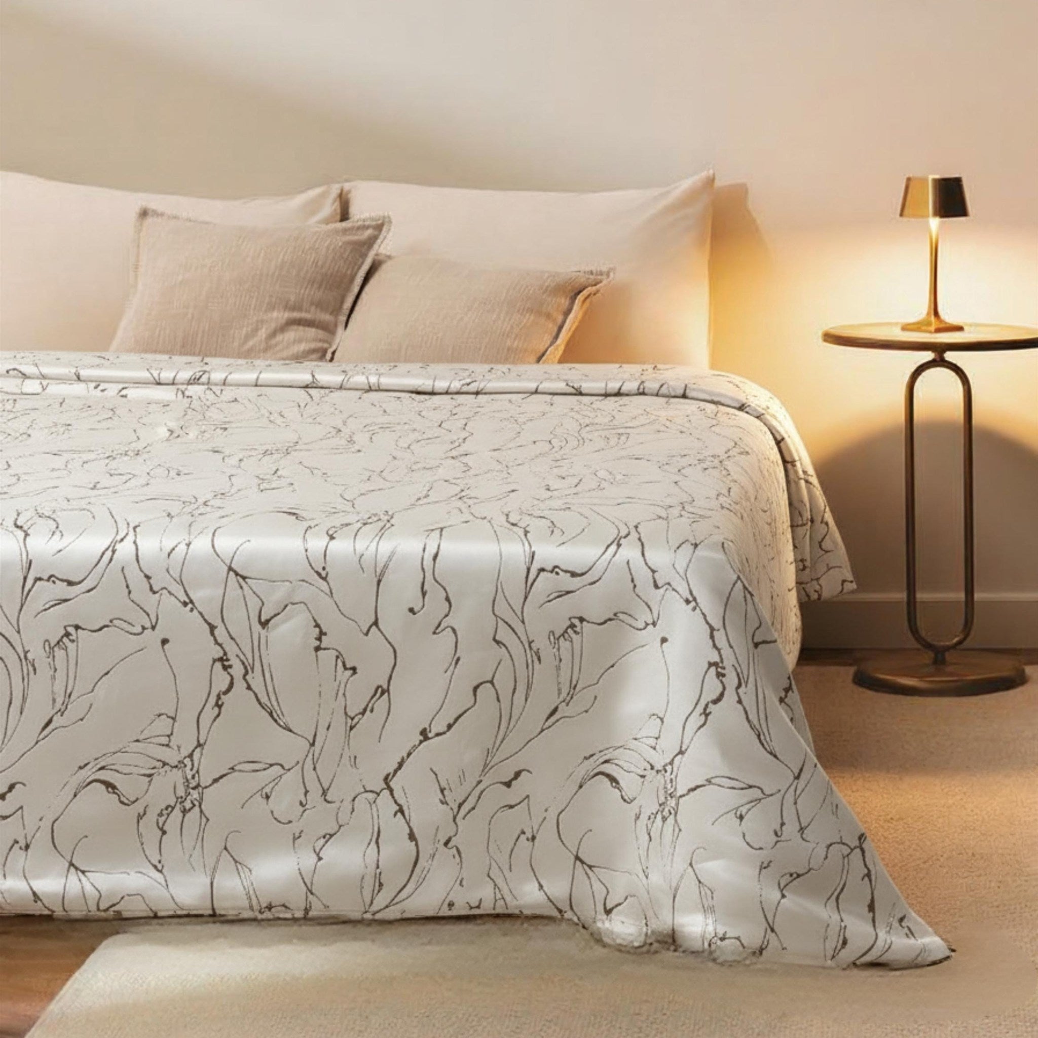 Cream and gold swirl velvet bedspread on a bed