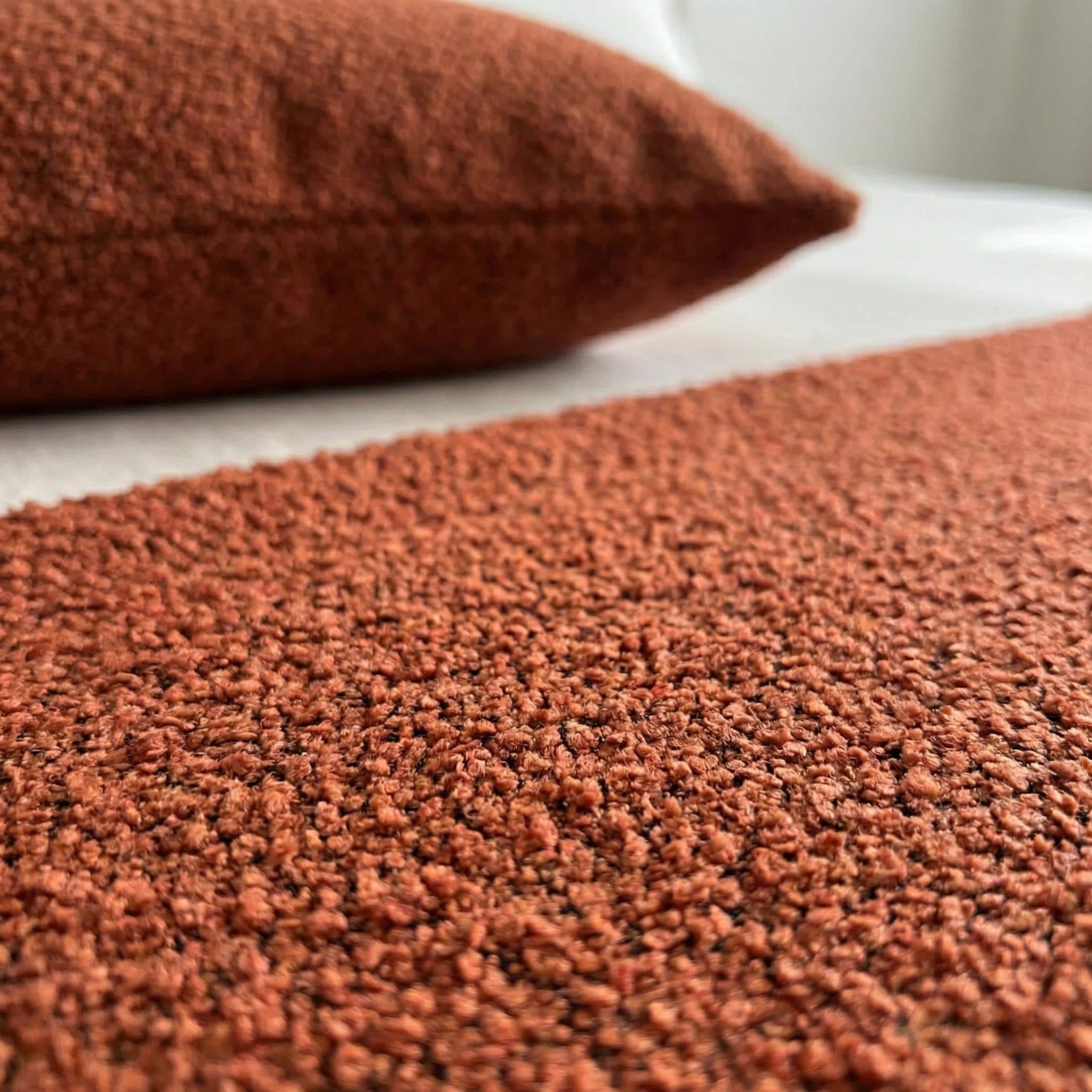 Terracotta boucle weave texture close-up