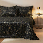 Black and gold swirl velvet bedspread on a bed