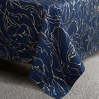 Black bedspread in navy bedroom