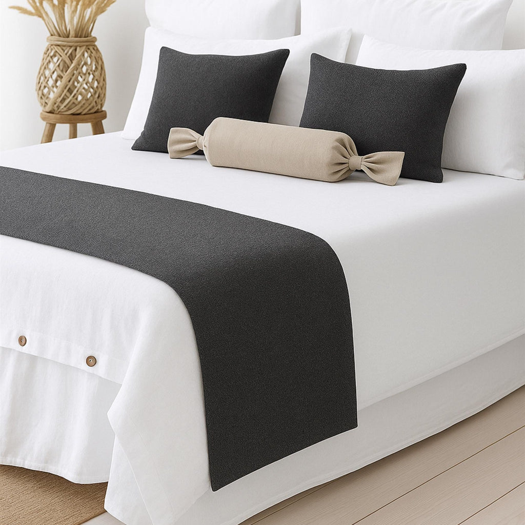 Linen bed runner on a white bed