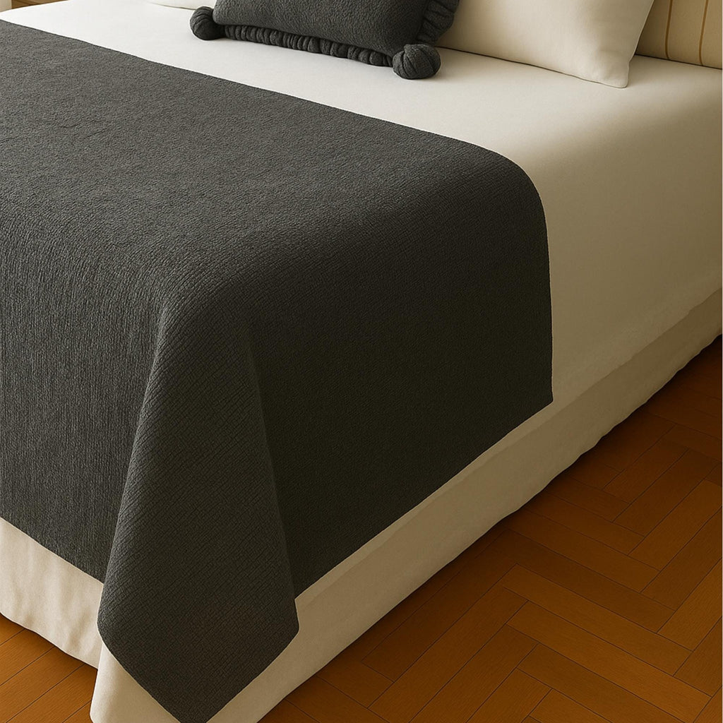 Linen bed runner draped over foot of bed