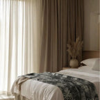 Velvet bed runner in bright bedroom
