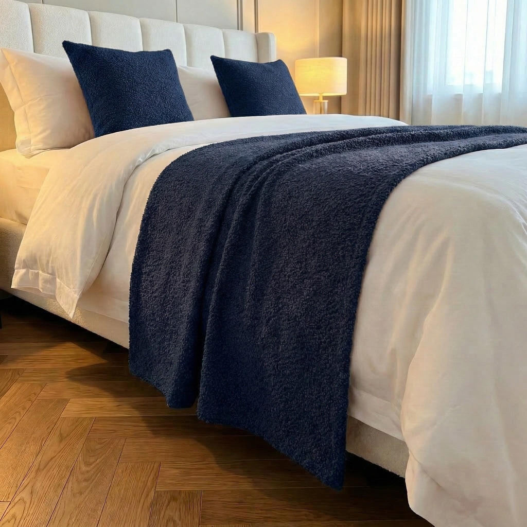 Navy blue runner styled with matching pillows