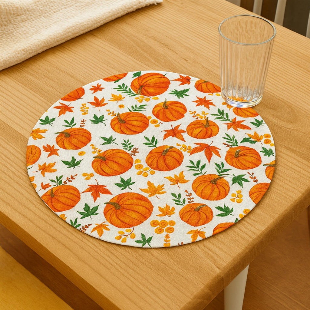 Round autumn pumpkin placemat on a wooden table