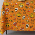 Orange Halloween trick or treat tablecloth on a table