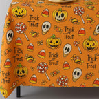 Orange Halloween trick or treat tablecloth on a table