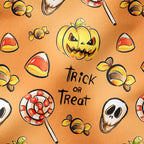 Trick or treat pattern close-up with jack-o'-lanterns and candy