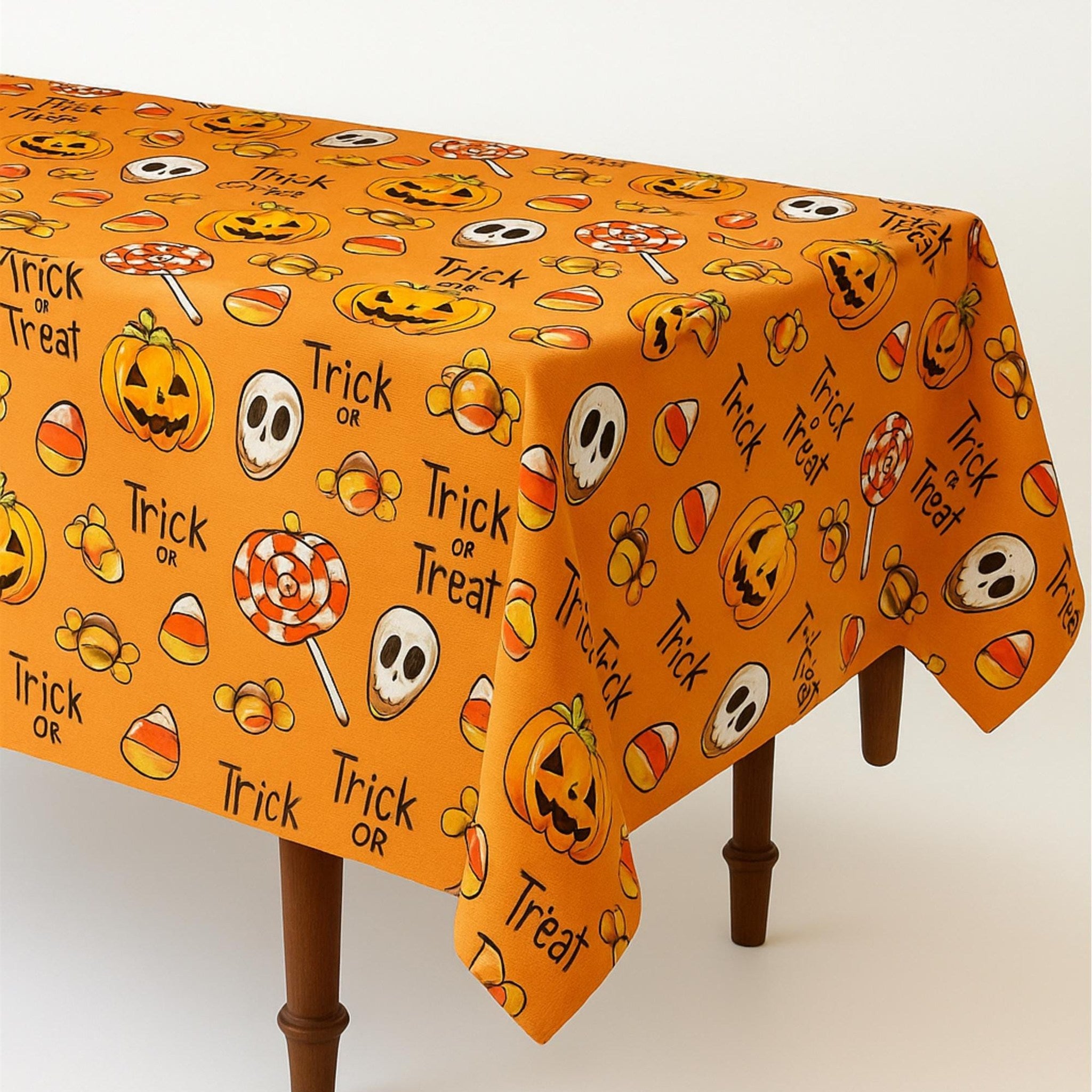 Orange Halloween tablecloth draped over a wooden table