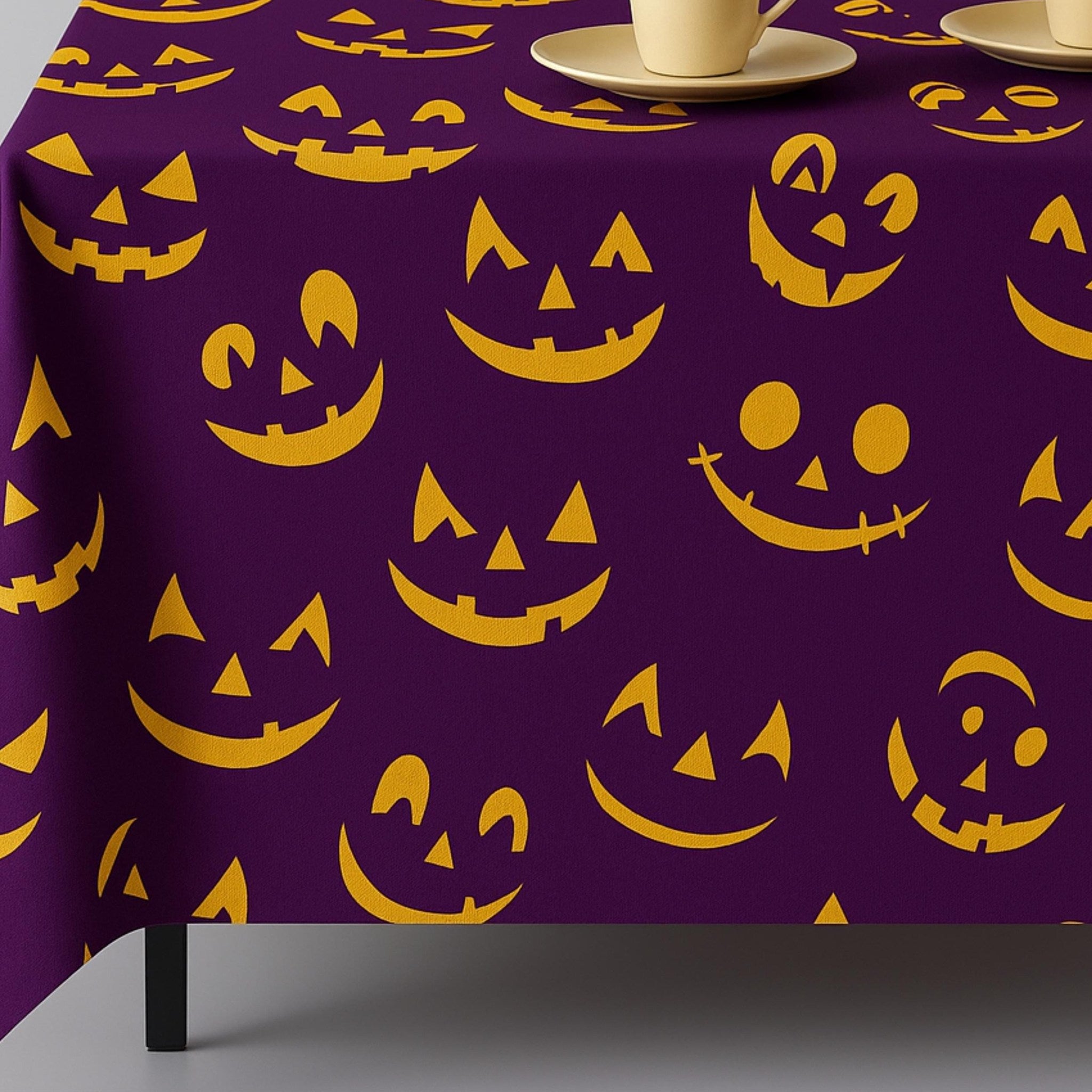 Purple Halloween tablecloth with glowing jack-o'-lantern faces