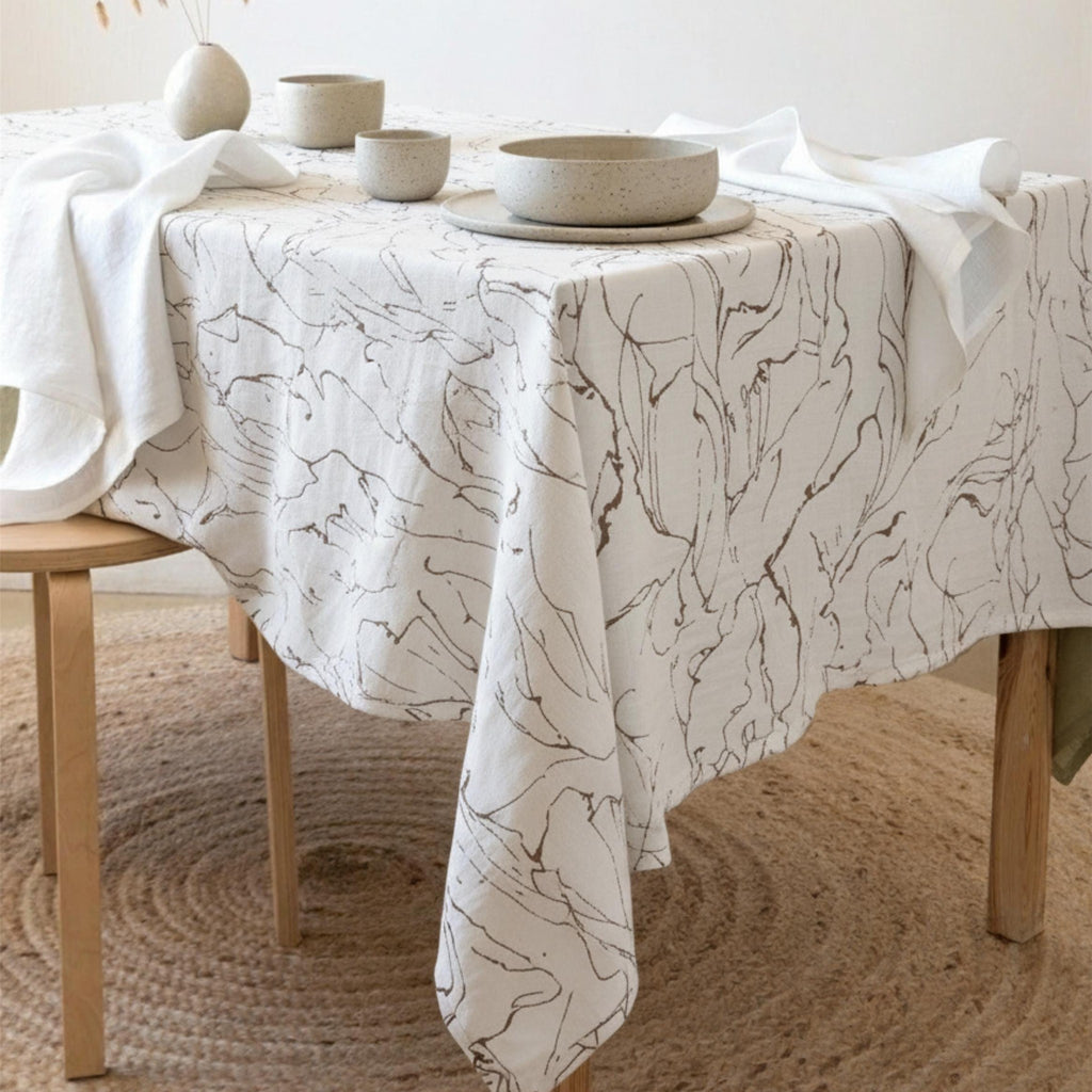 Marble swirl velvet tablecloth draped over an elegant dining table