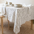Marble swirl velvet tablecloth draped over an elegant dining table