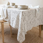 Marble swirl velvet tablecloth draped over an elegant dining table