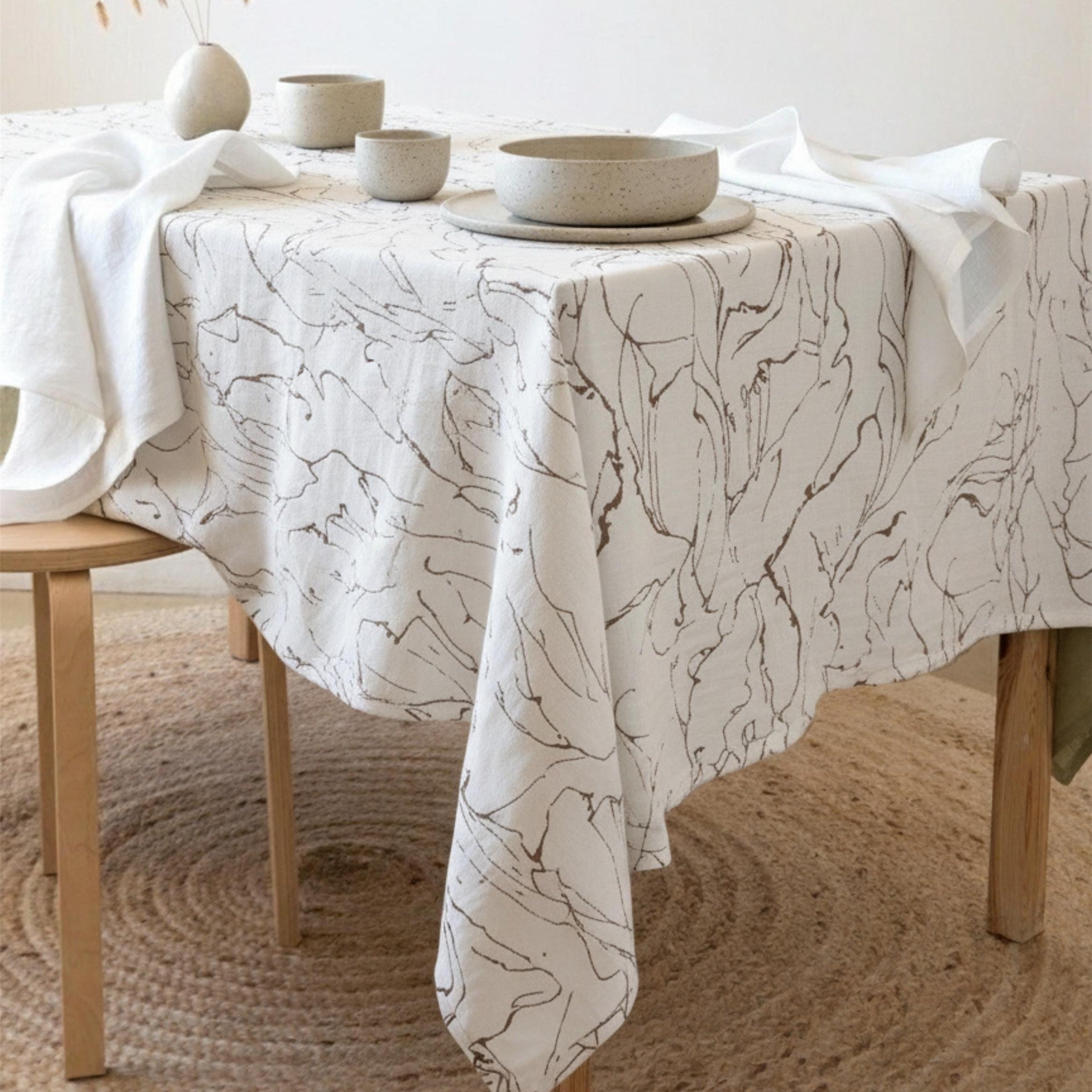 Marble swirl velvet tablecloth draped over an elegant dining table