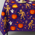 Halloween tablecloth with mummy and pumpkin print on a table
