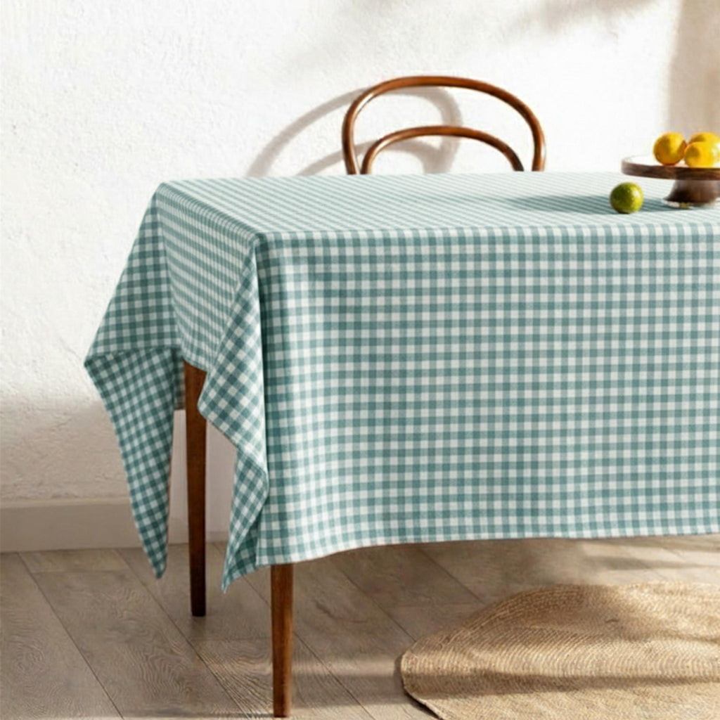 Mint green gingham cotton tablecloth on a sunlit breakfast table
