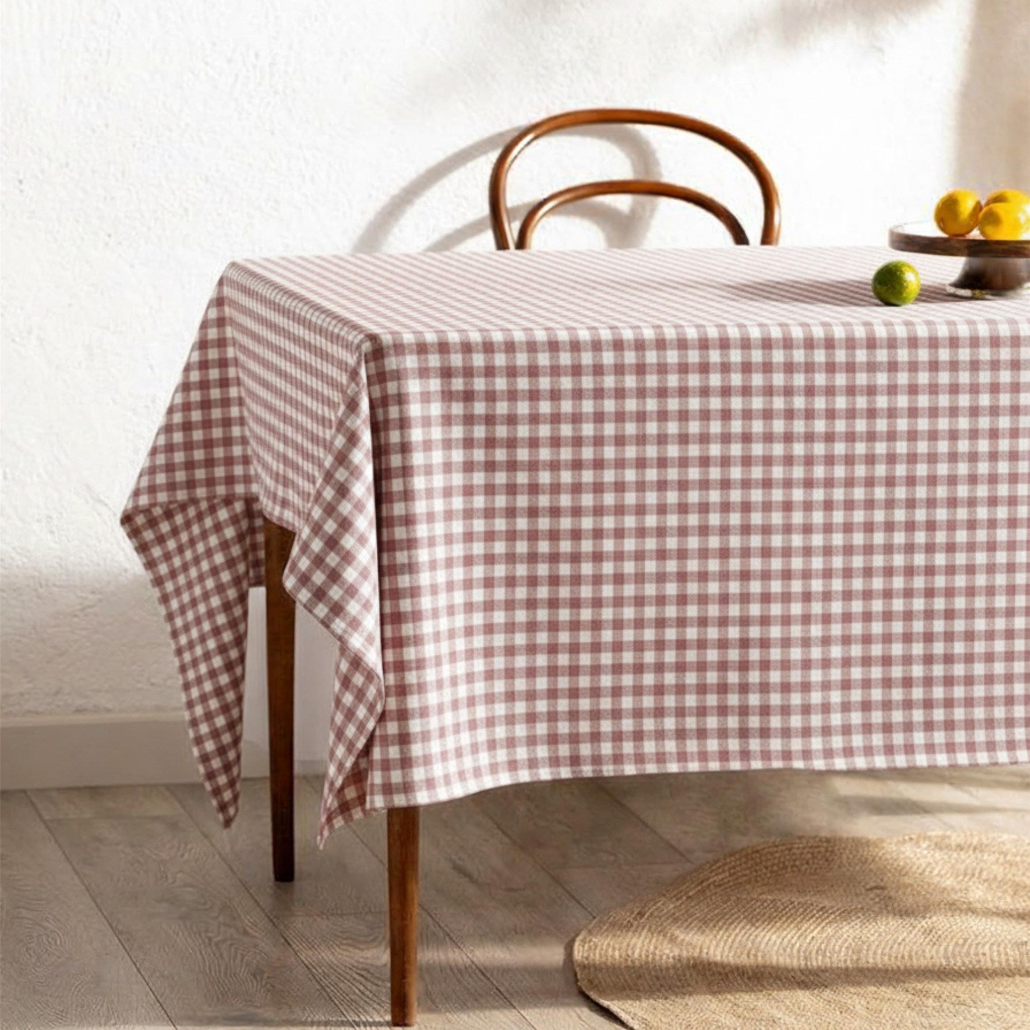 Powder pink check gingham cotton tablecloth on a cozy dining table