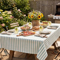 Mint green striped cotton tablecloth set for an outdoor garden lunch