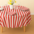 Red striped cotton tablecloth on a terrace table set for dining