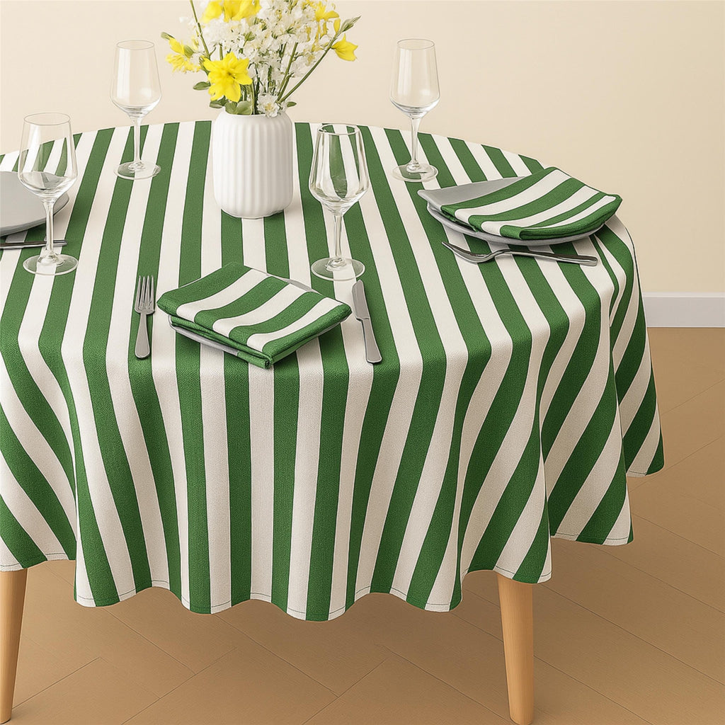 Green striped cotton tablecloth covering a farmhouse kitchen table