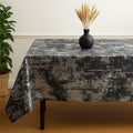 Dark gray velvet tablecloth with copper sheen on a formal dining table