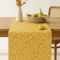 Yellow botanical cotton table runner on dining table