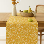 Yellow botanical cotton table runner on dining table