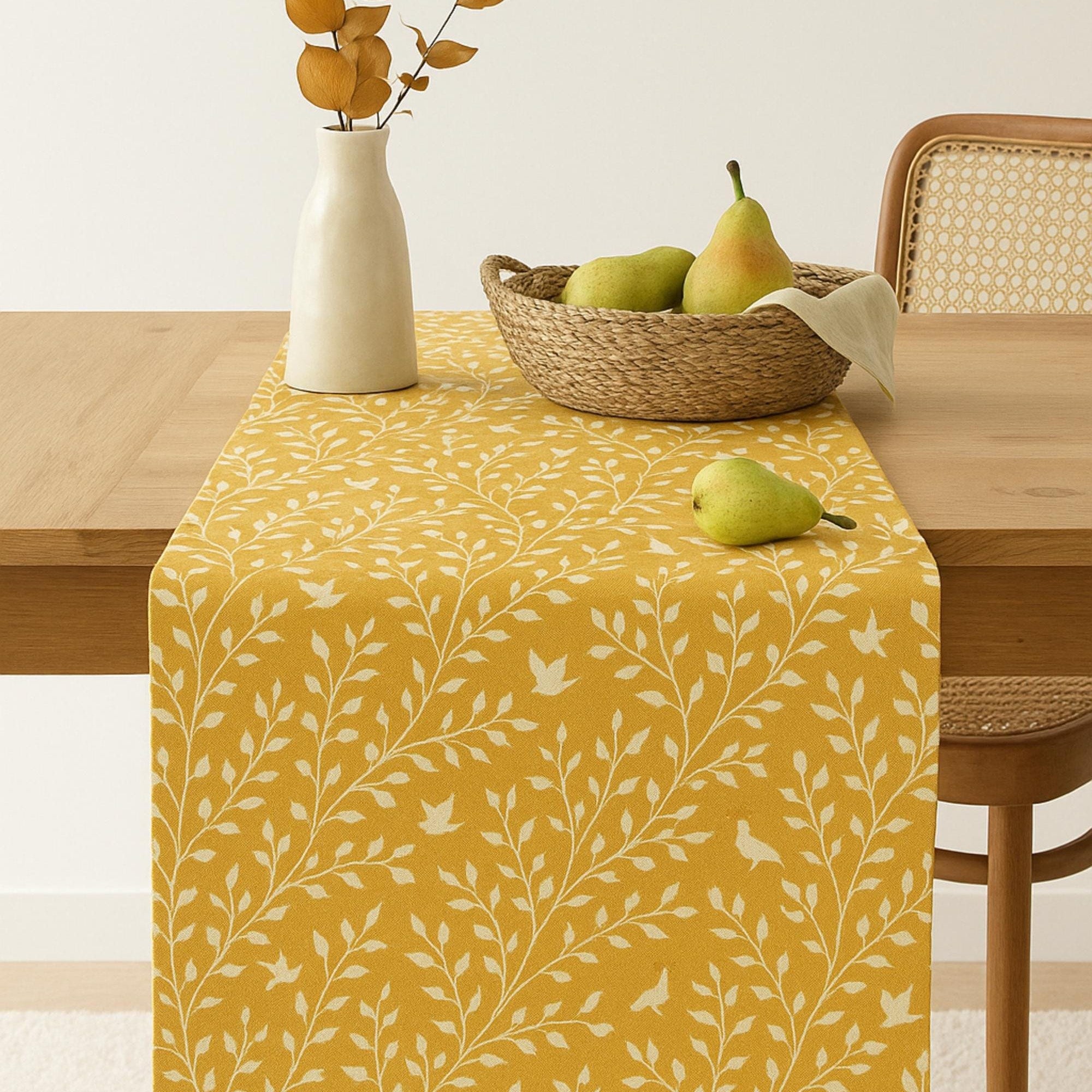Yellow botanical cotton table runner on dining table