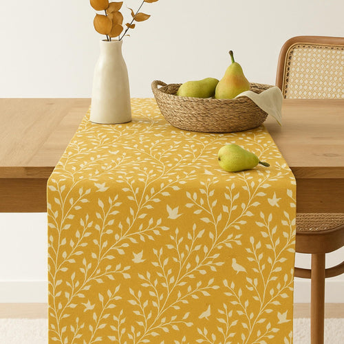 Yellow botanical cotton table runner on dining table