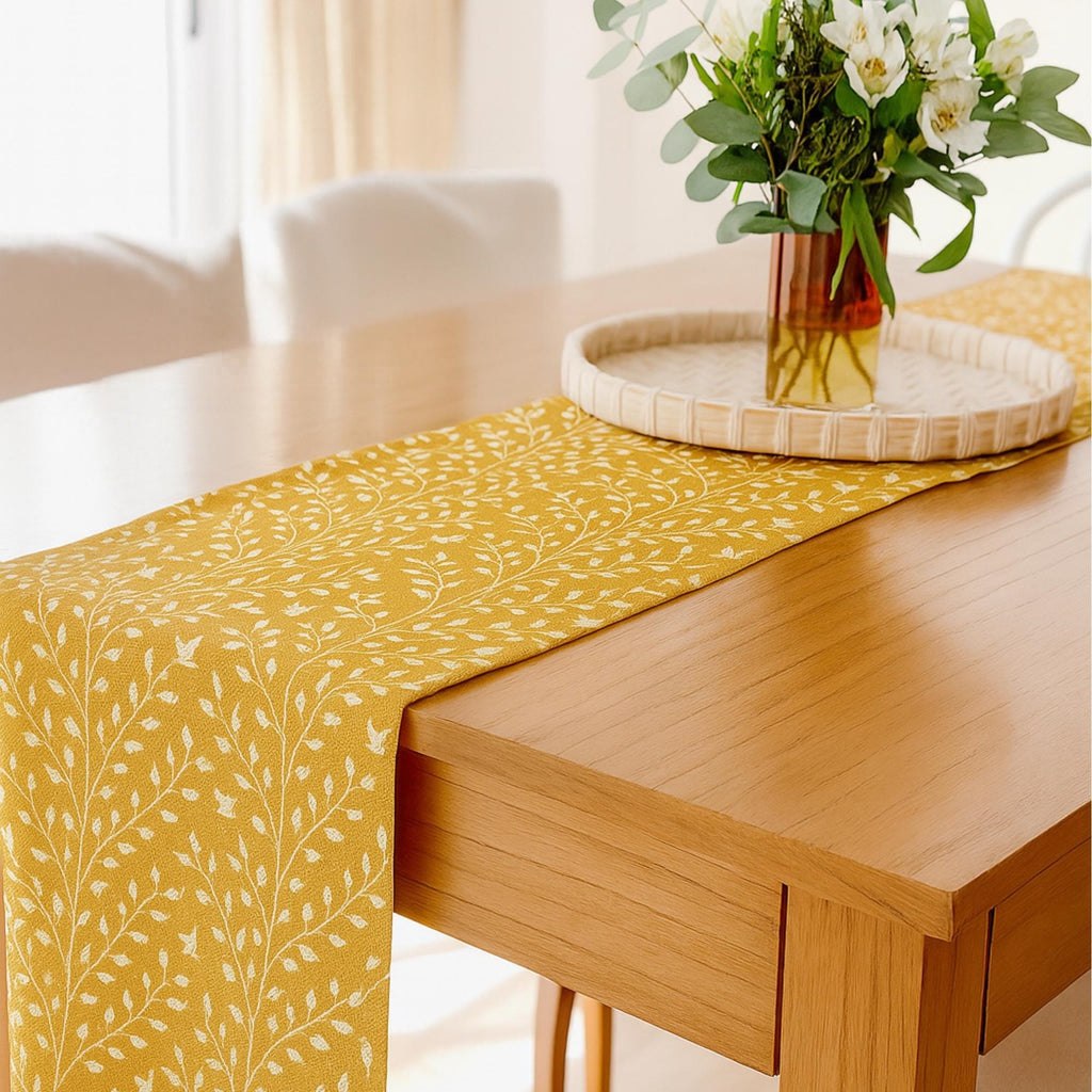 Botanical cotton table runner with flower centerpiece