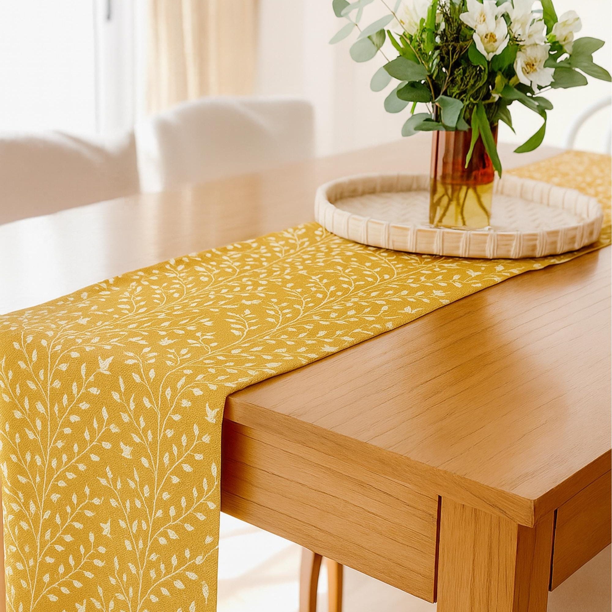 Botanical cotton table runner with flower centerpiece