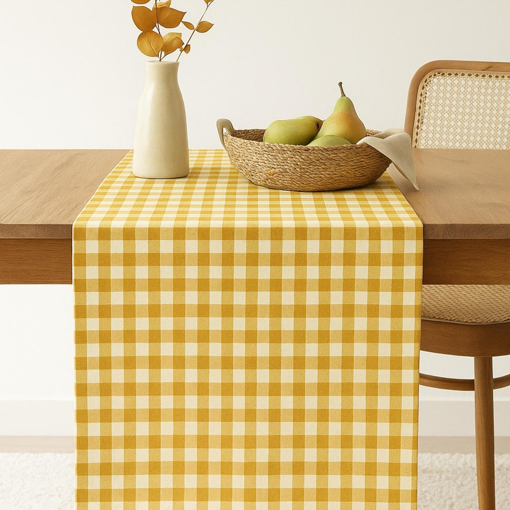 Yellow gingham cotton table runner on dining table
