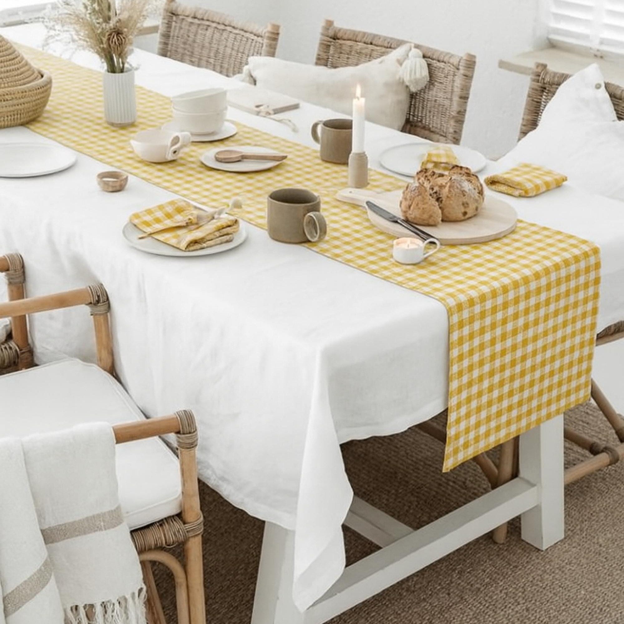 Gingham cotton table runner styled with white tablecloth