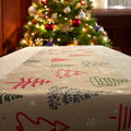 Beige Christmas tree print table runner by the tree