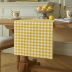 Yellow gingham cotton table runner in classic dining room