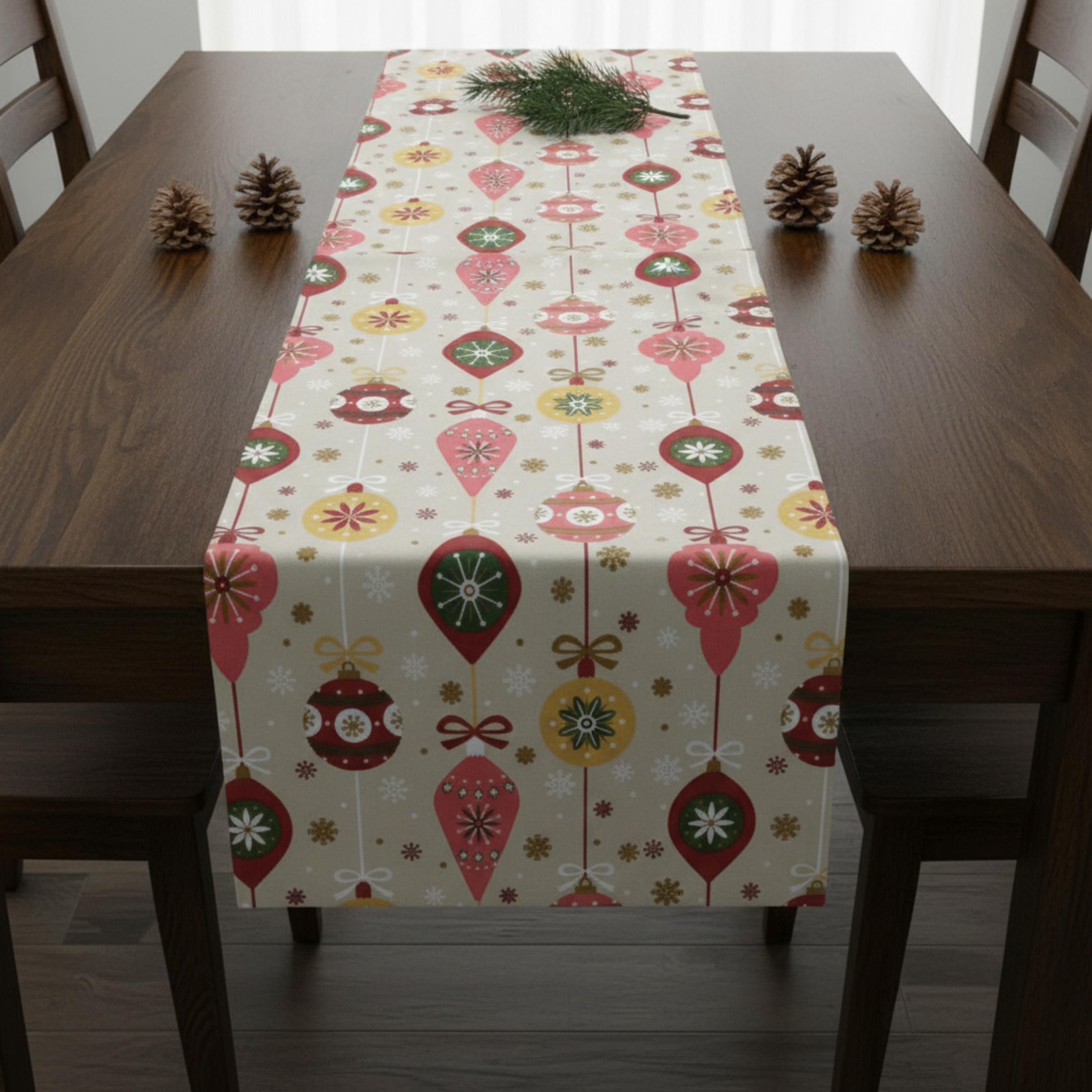 Beige Christmas table runner on dark wood table with pinecones