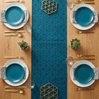 Geometric cube velvet table runner top view with teal plates