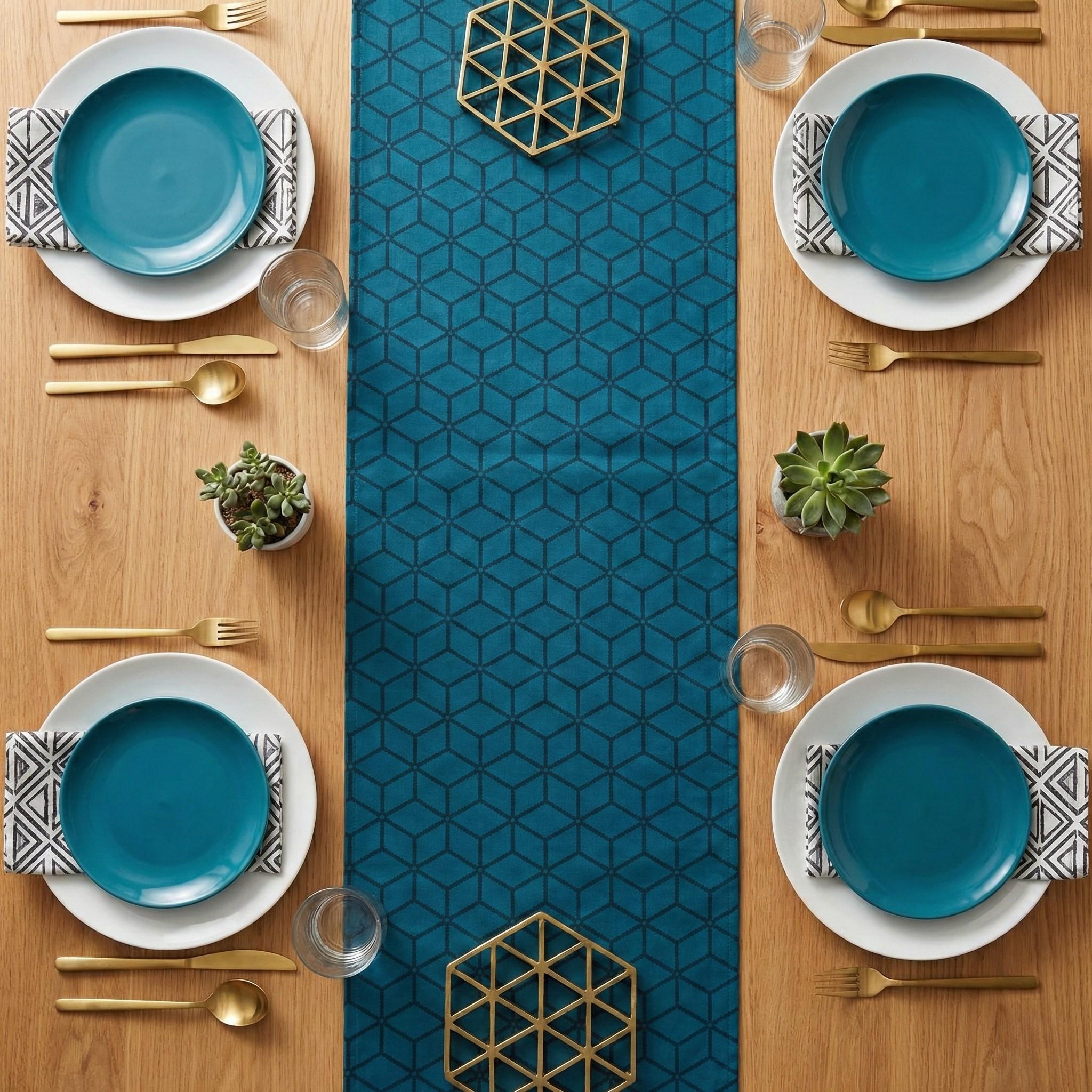 Geometric cube velvet table runner top view with teal plates