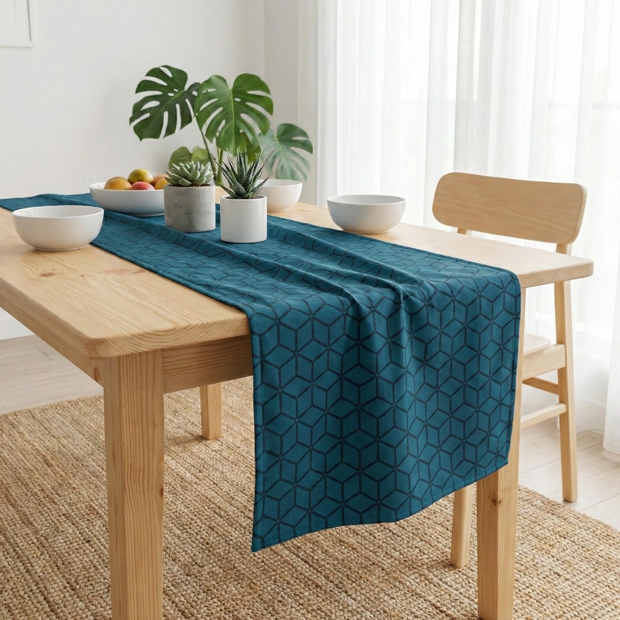 Navy blue geometric cube velvet table runner on light wood table