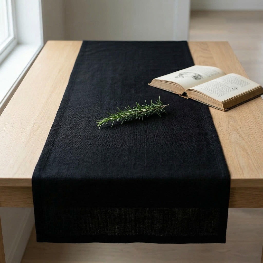 Black linen table runner on dining table